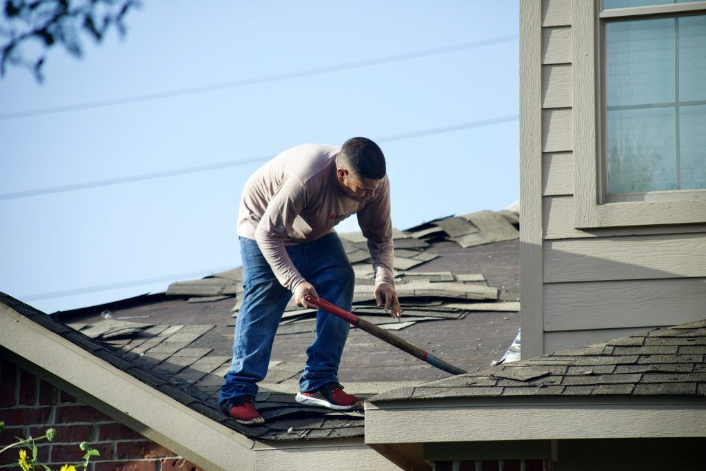 San Diego residential roofing contractor reviewing roof condition